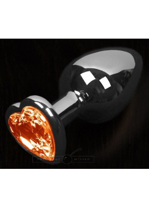 Графитовая анальная пробка с оранжевым кристаллом в виде сердечка - 8,5 см.